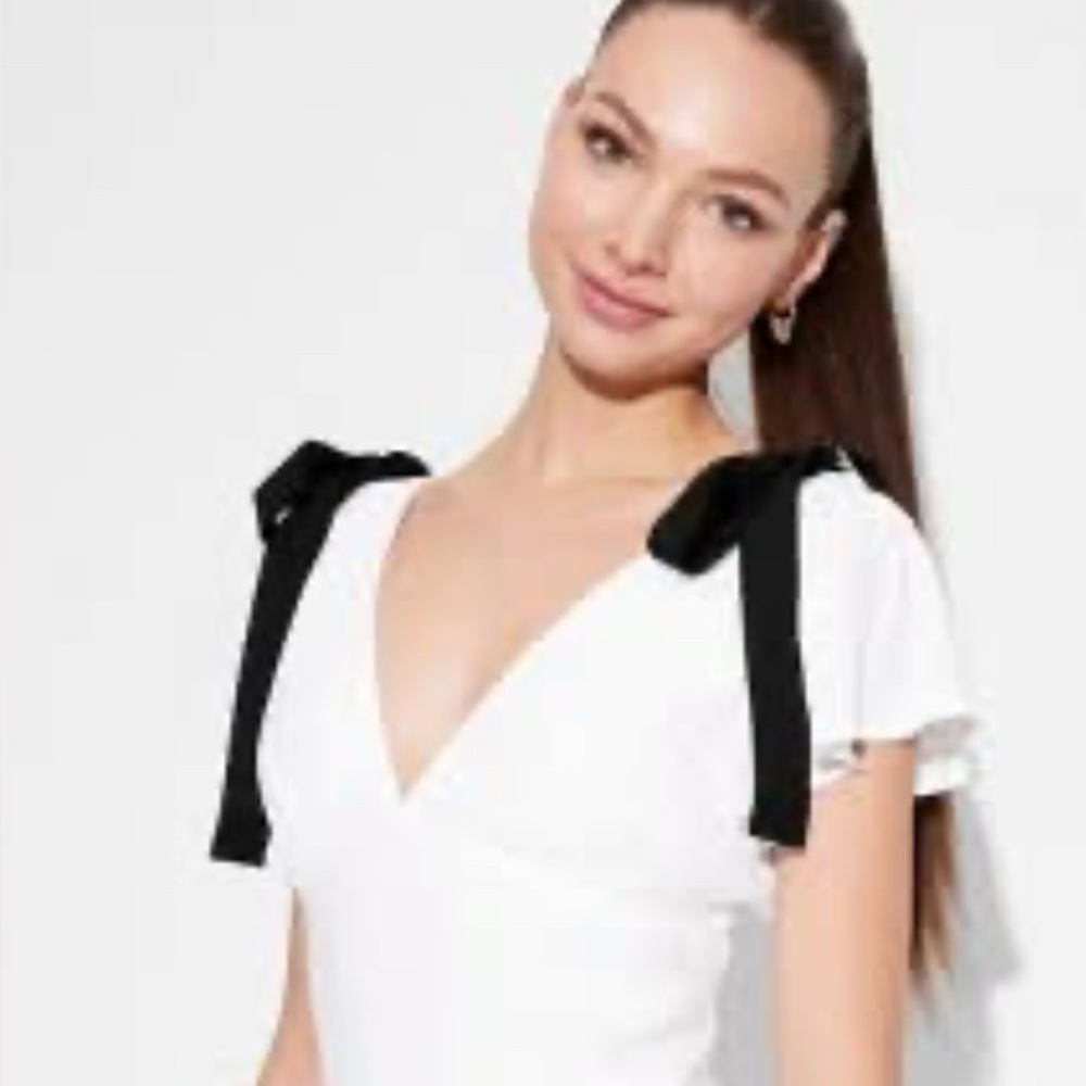 Chic White Mini Dress with Black Shoulder Bows